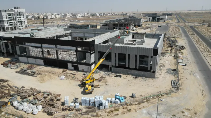 The corner with the precast concrete fins, next to the black-framed front