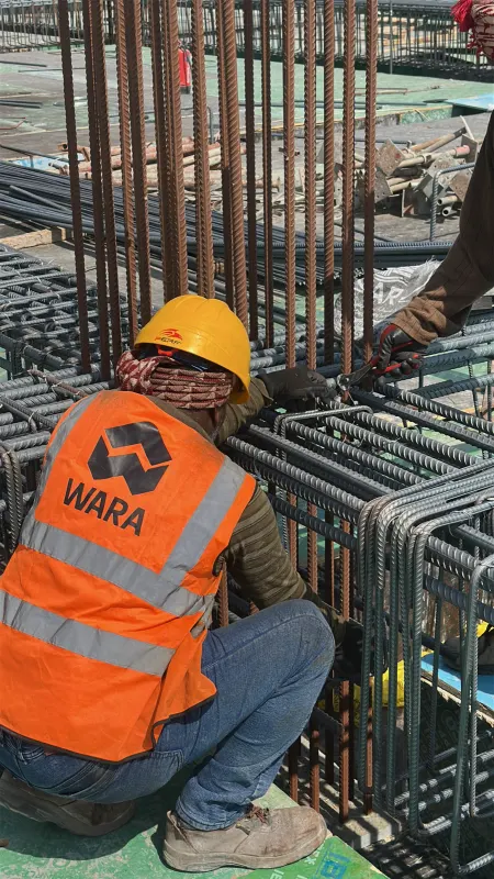 A Wara Construction steel fixer tying a column cage